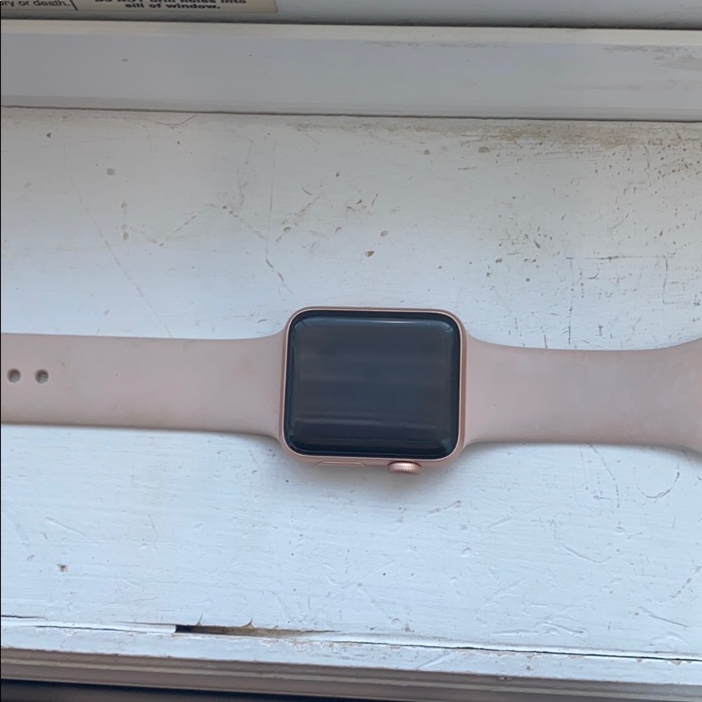 Rose gold Apple Watch series 3 with charger